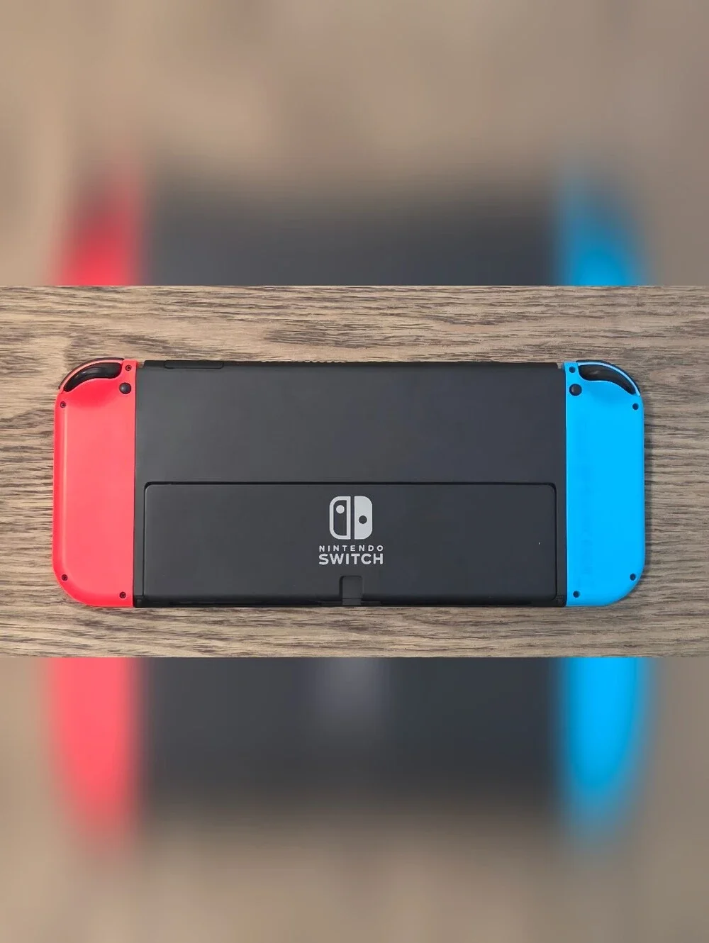 Nintendo Switch OLED - Neon Blue/Neon Red Renewed